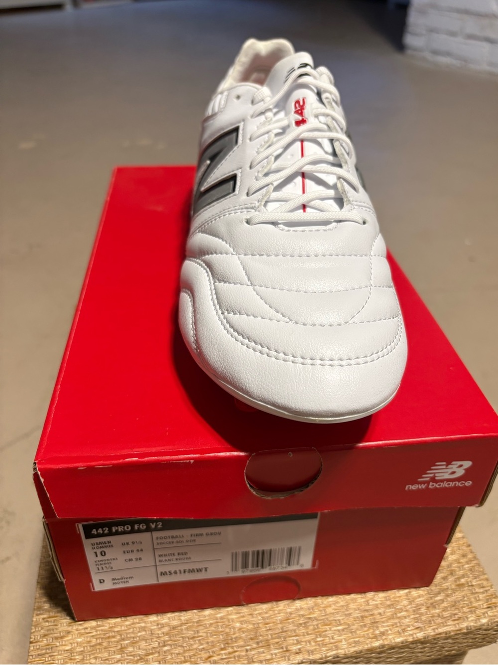 New Balance White with Black Accent Men's Athletic Soccer Shoe